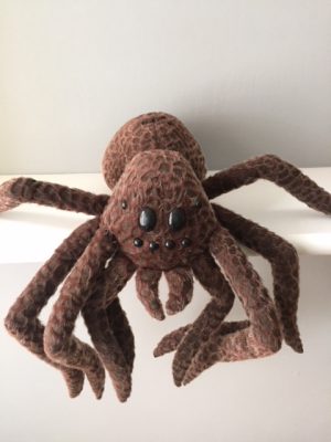 large brown soft toy spider from Harry Potter.