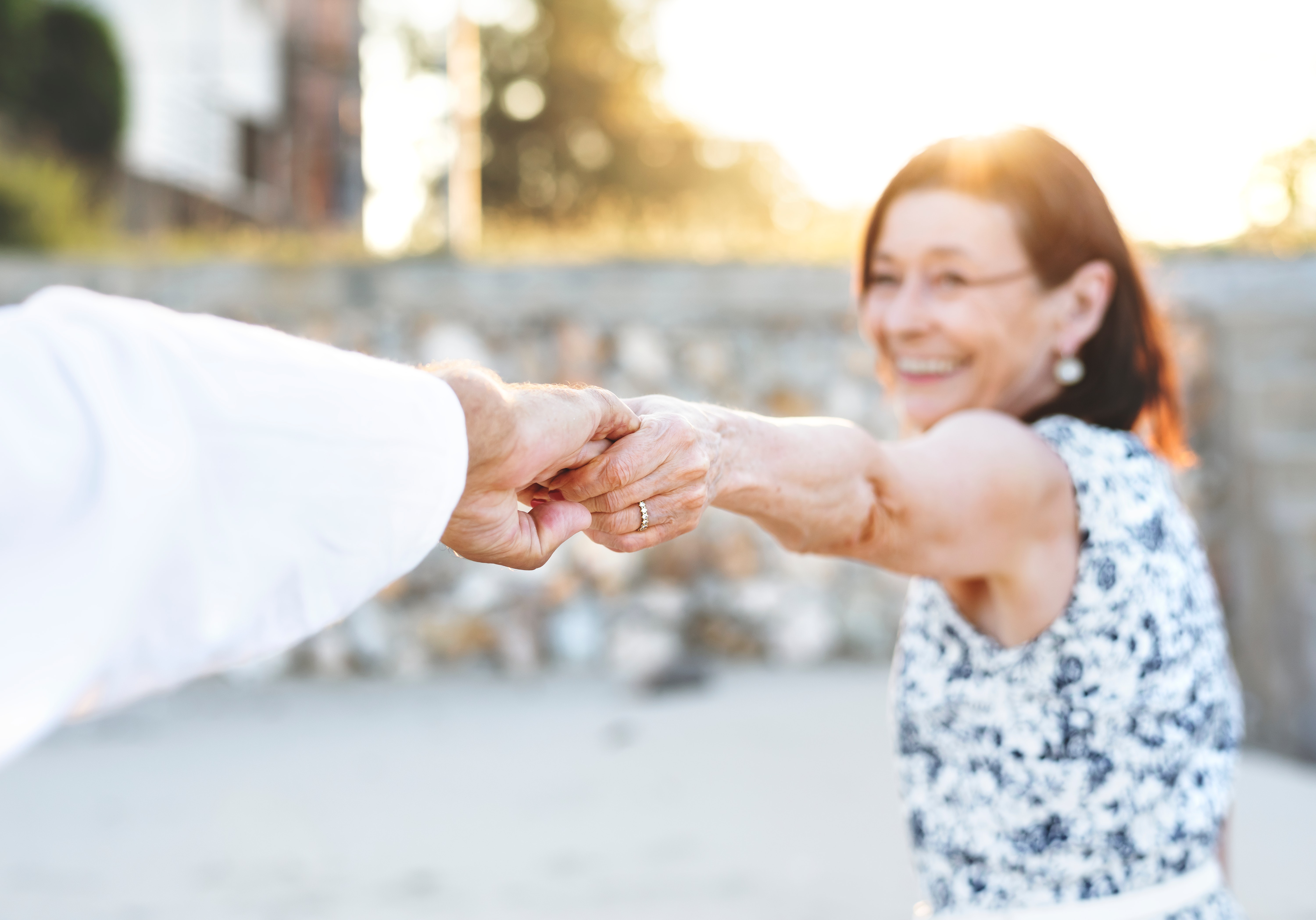 couple holding hands.